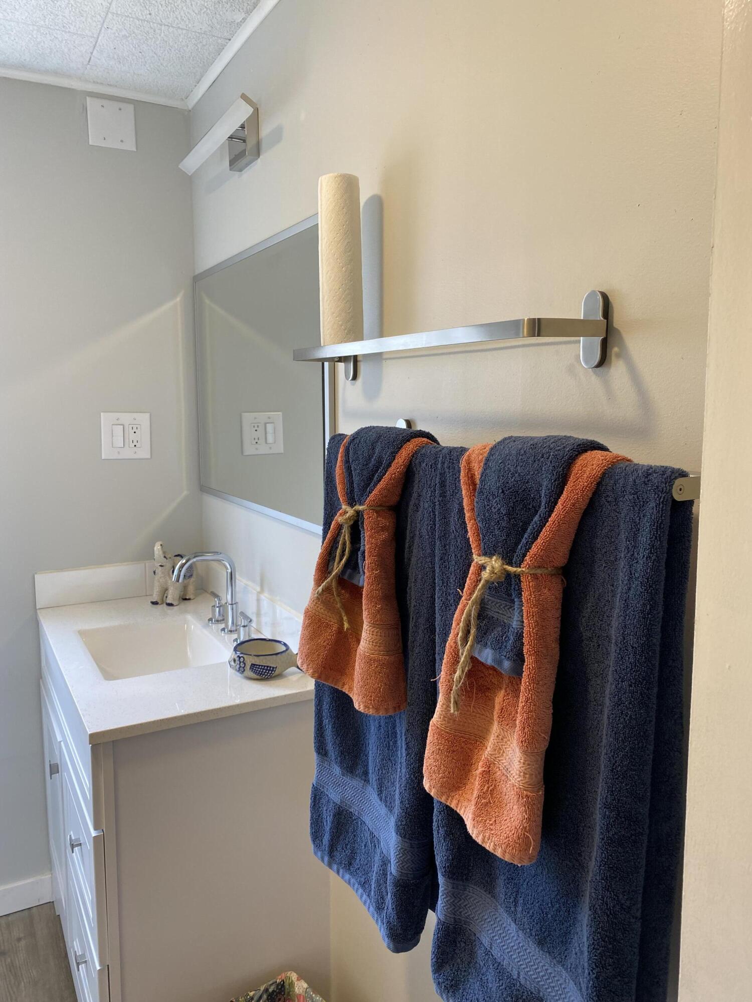 597 South Wilson Street Crestview, FL 32536 - Photo 10 of 16 a view of walk in closet with clothes and shoes