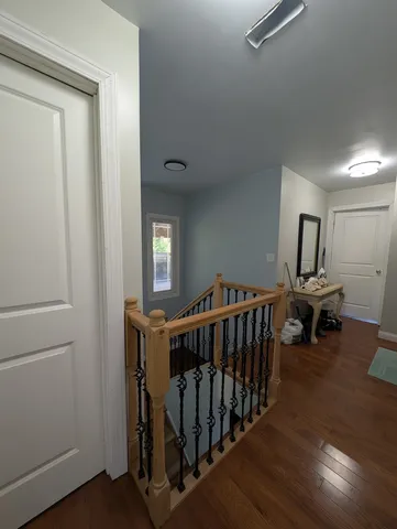 a living room with furniture a rug and a window