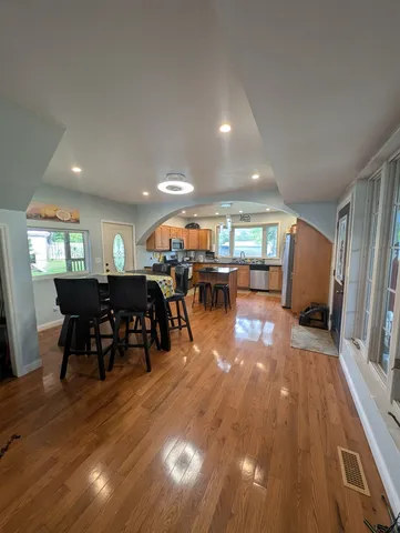 a lobby with furniture and wooden floor