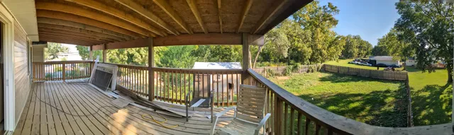 a view of balcony with wooden floor