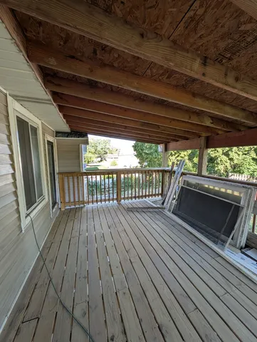 a view of outdoor space with wooden floor