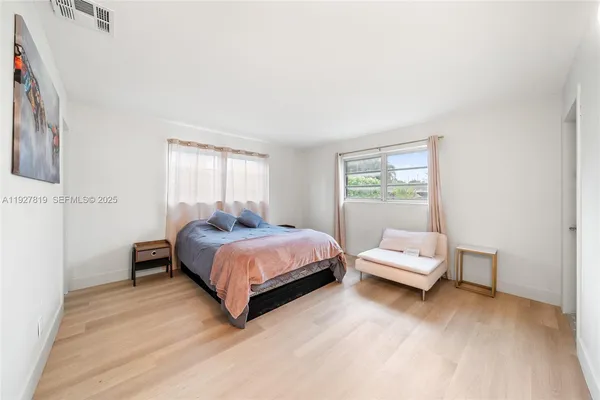 a bed room with a bed and a window