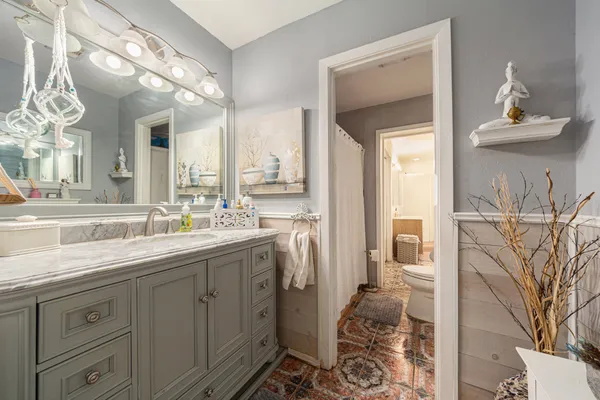 a bathroom with a double vanity sink and mirror