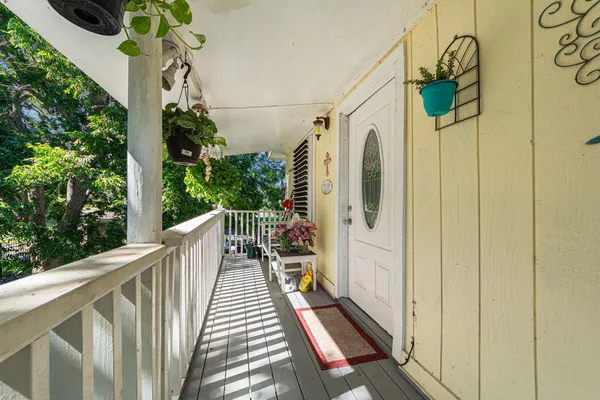 a view of balcony with wooden floor