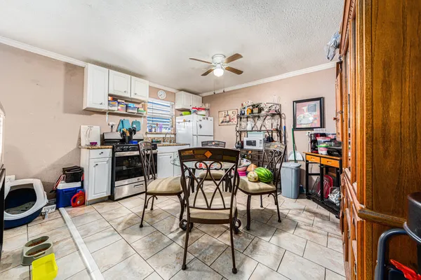 a living room with lots of furniture and appliances