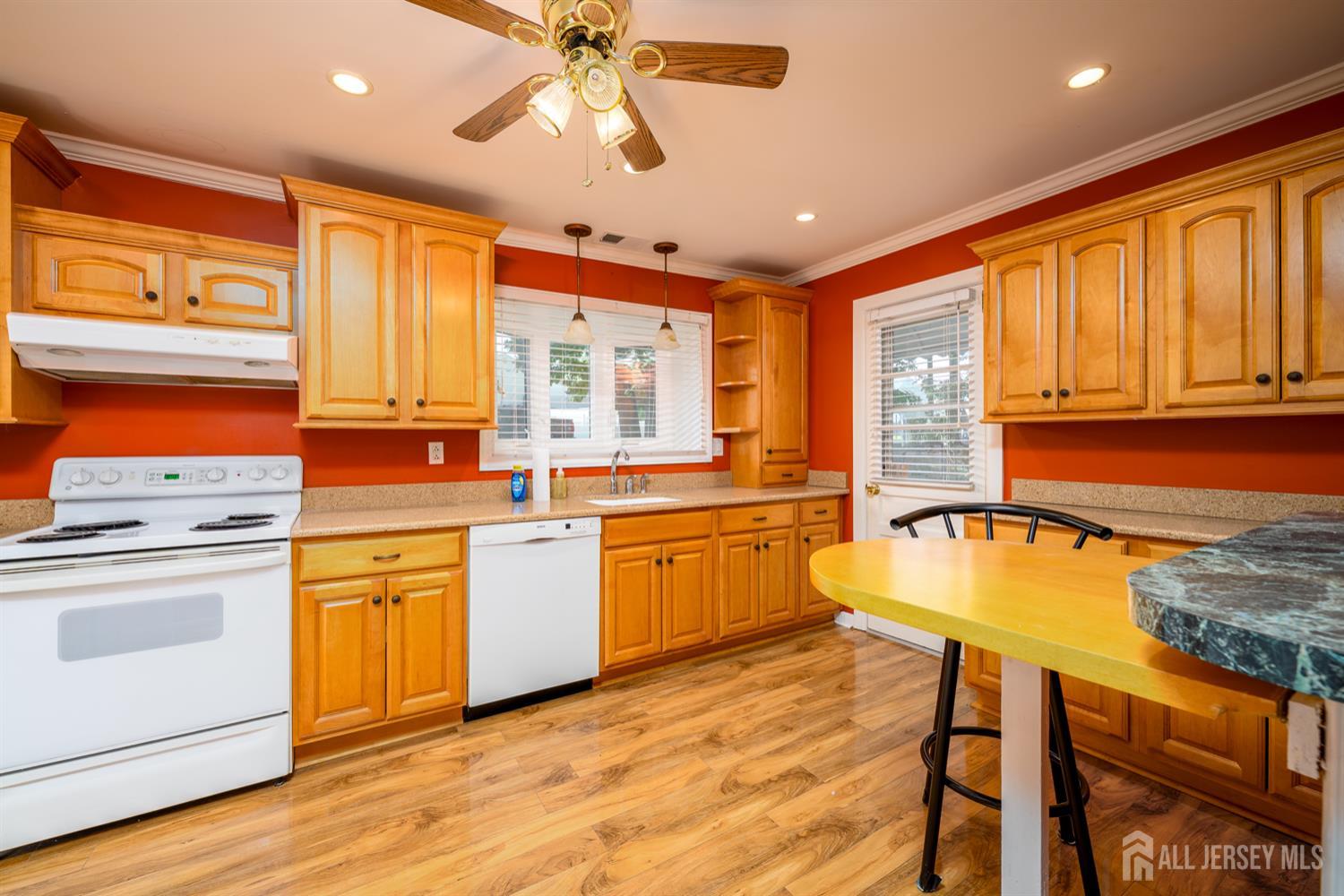 65 Orange Street Edison, NJ 08817 - Photo 11 of 51 a kitchen with a stove a sink and a refrigerator