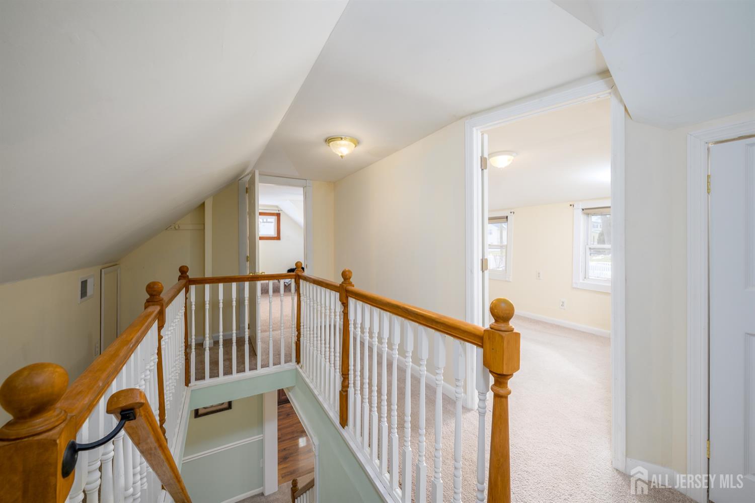 65 Orange Street Edison, NJ 08817 - Photo 17 of 51 a view of a hallway with wooden floor and stairs