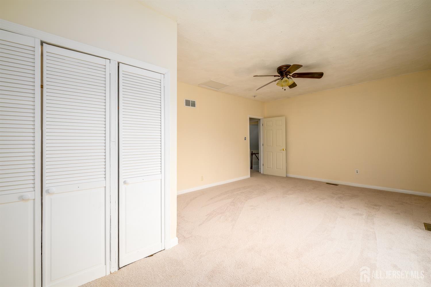 65 Orange Street Edison, NJ 08817 - Photo 20 of 51 a view of empty room with a ceiling fan