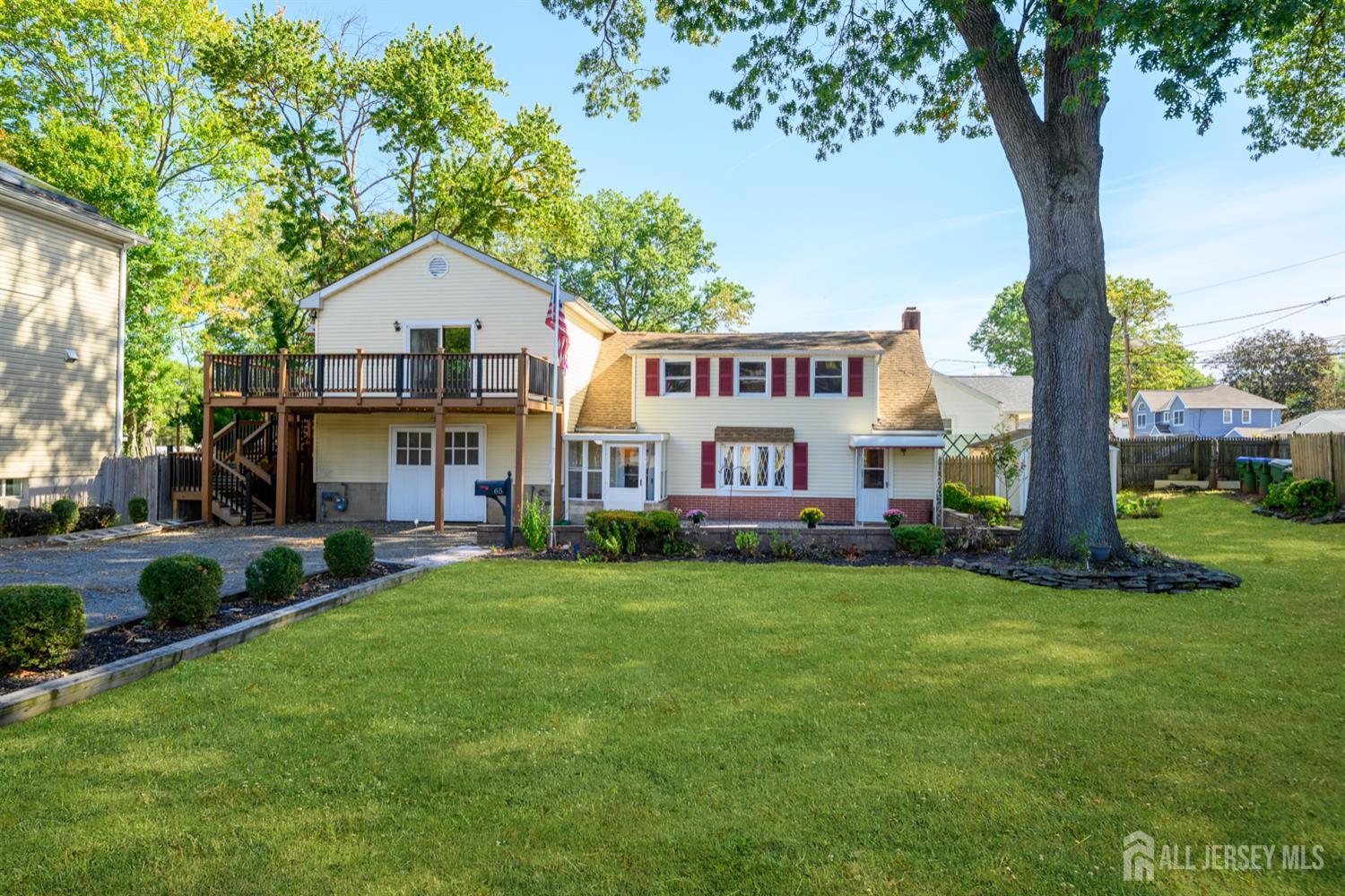 65 Orange Street Edison, NJ 08817 - Photo 3 of 51 a view of a house with a yard
