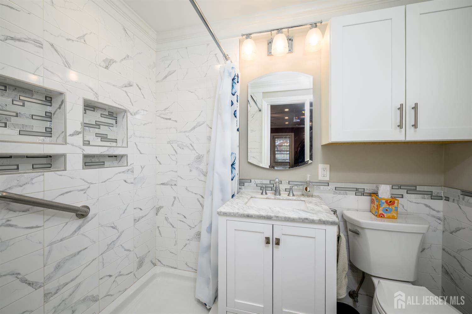 65 Orange Street Edison, NJ 08817 - Photo 32 of 51 a bathroom with a sink vanity granite and a toilet