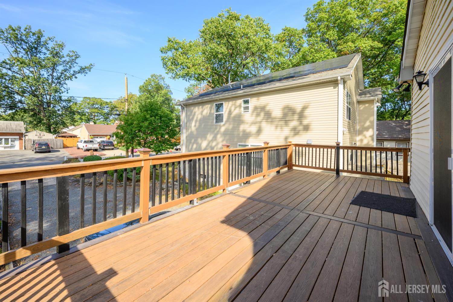 65 Orange Street Edison, NJ 08817 - Photo 44 of 51 a view of a wooden deck with a yard