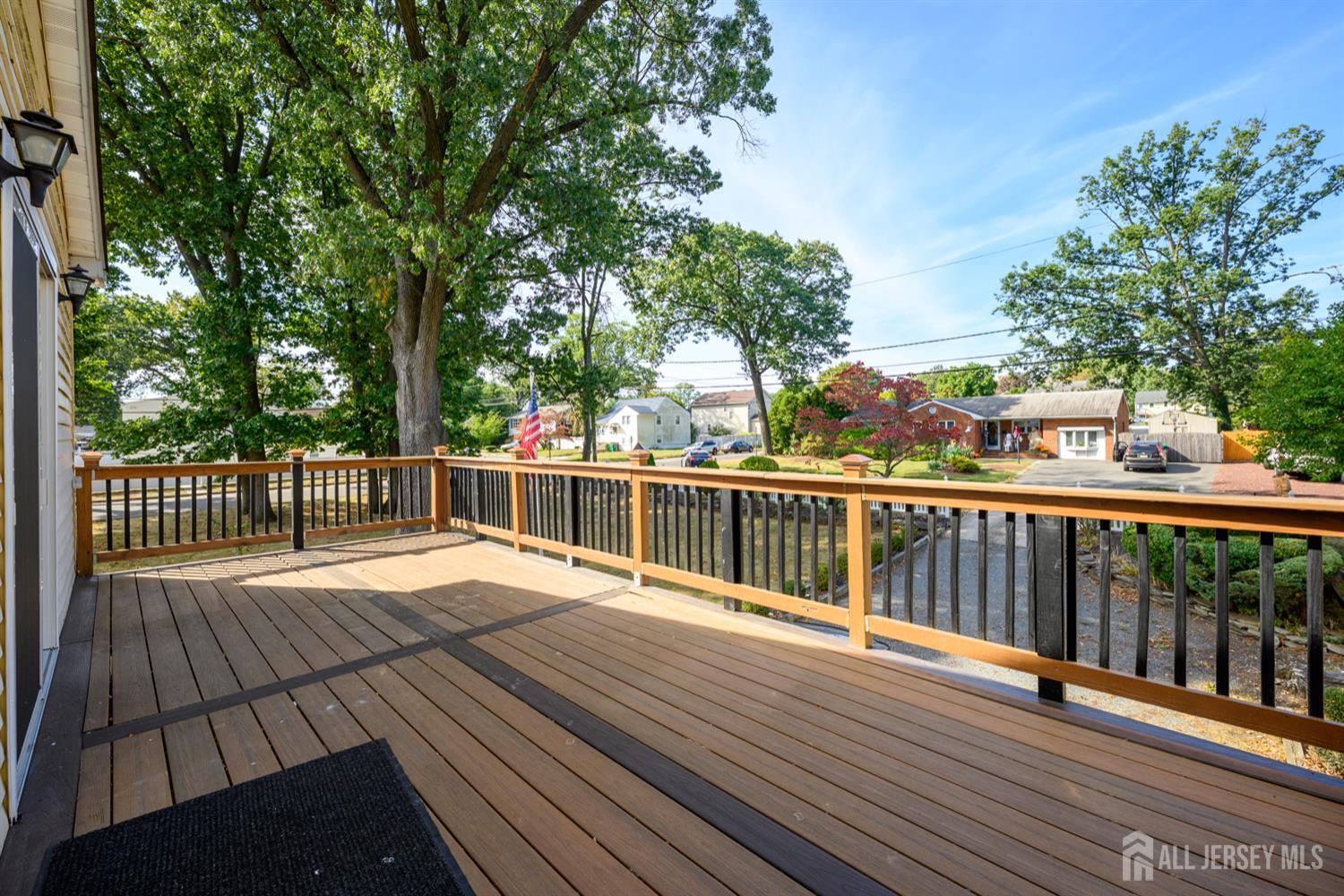 65 Orange Street Edison, NJ 08817 - Photo 47 of 51 a view of deck with wooden floor and fence