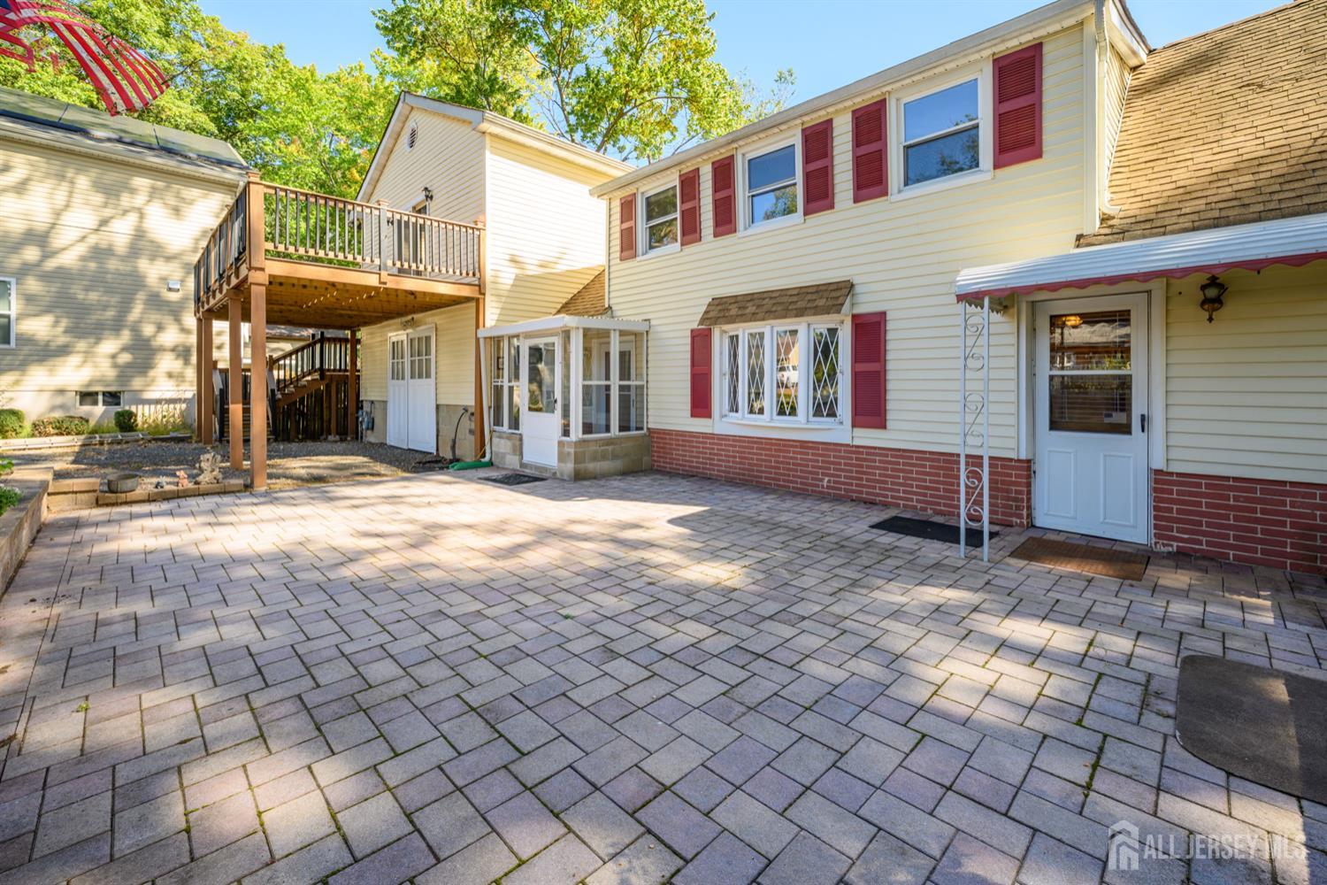 65 Orange Street Edison, NJ 08817 - Photo 7 of 51 a view of a brick house with many windows