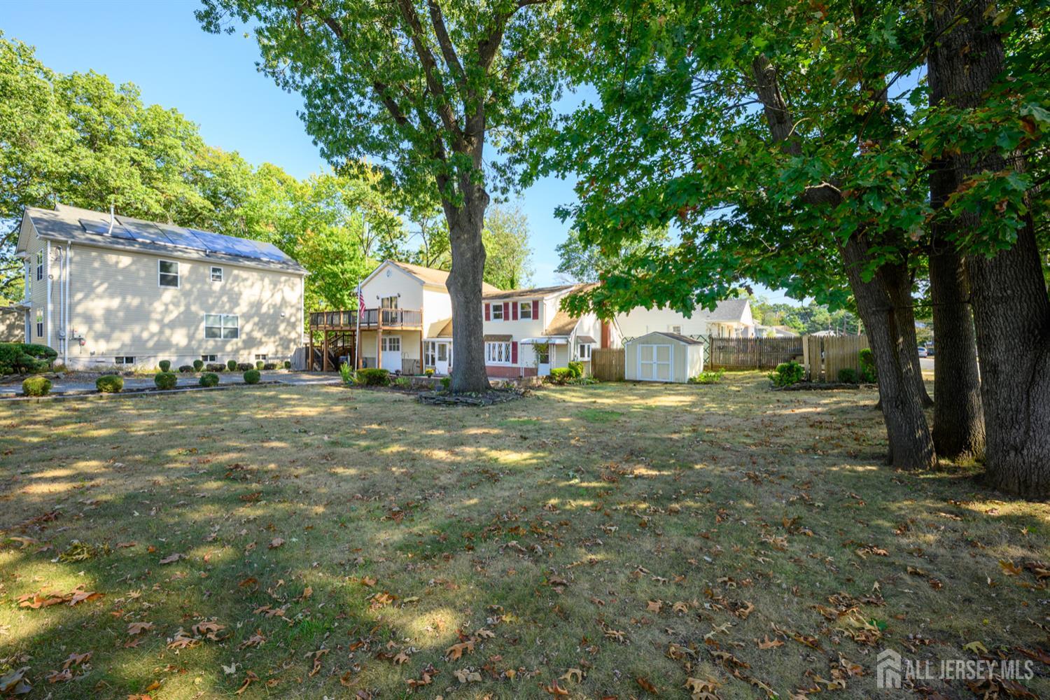 65 Orange Street Edison, NJ 08817 - Photo 8 of 51 a view of yard with tree