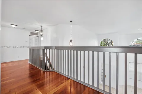 a view of a porch with a floor to ceiling window next to a yard