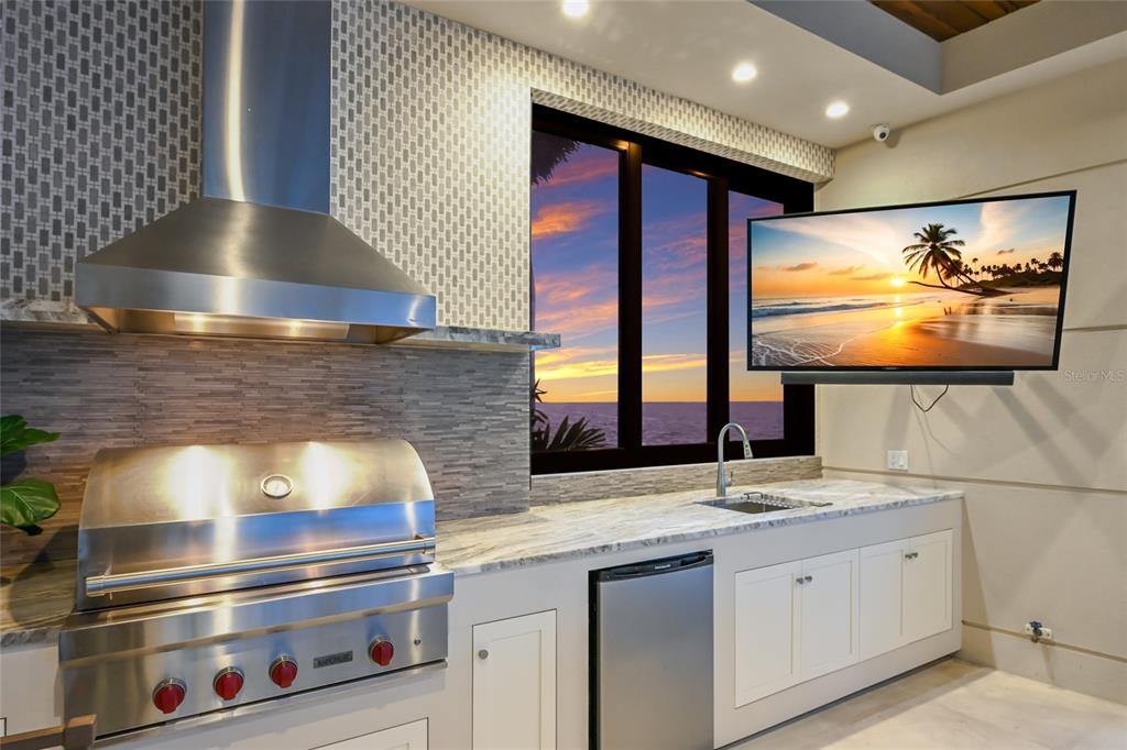 600 Wedge Lane Longboat Key, FL 34228 - Photo 14 of 82 a kitchen with stainless steel appliances granite countertop a sink and a stove