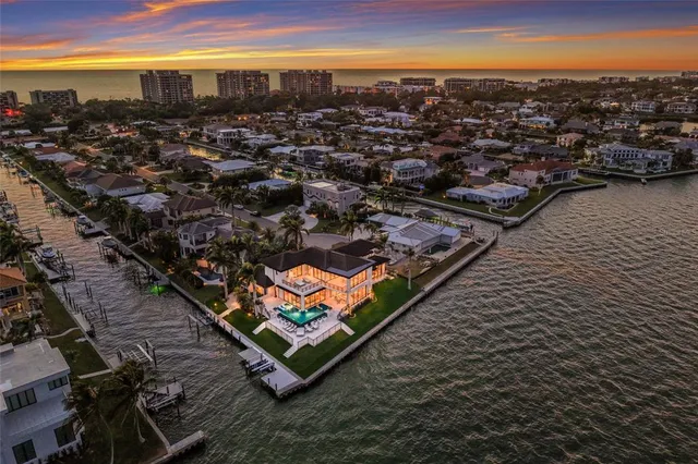 a room with a large bed and a large window