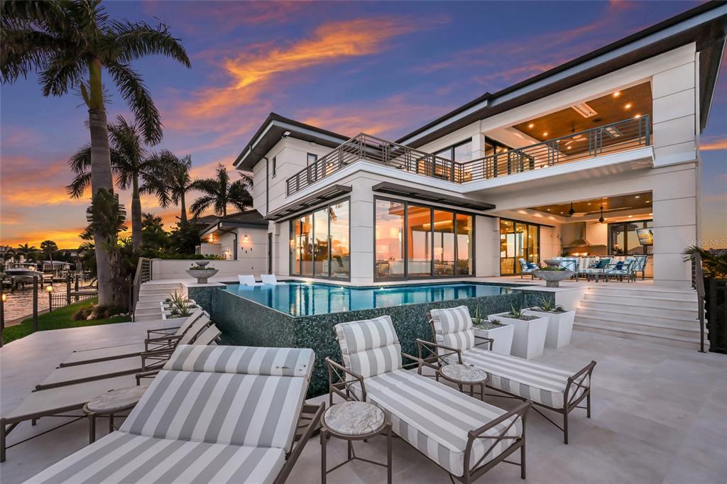 600 Wedge Lane Longboat Key, FL 34228 - Photo 21 of 82 a view of a patio with couches table and chairs