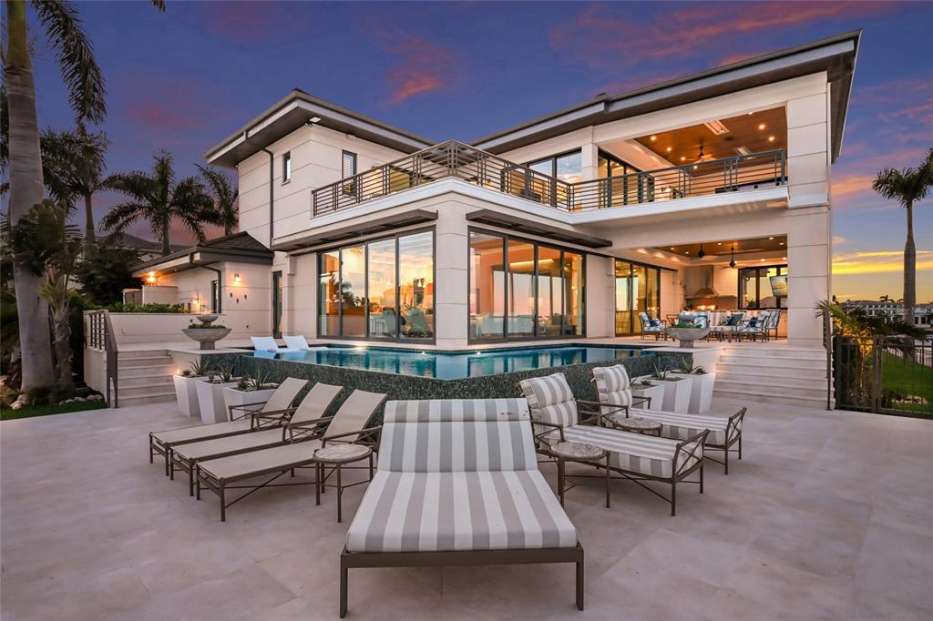 600 Wedge Lane Longboat Key, FL 34228 - Photo 22 of 82 a roof deck with a couch and chairs