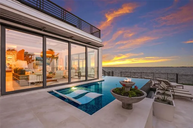 a front view of a house with a garden and yard