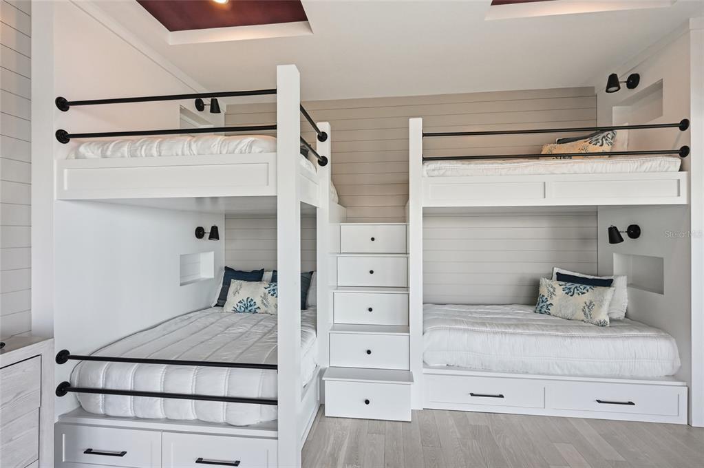 600 Wedge Lane Longboat Key, FL 34228 - Photo 57 of 82 a bedroom with a bed and a cabinets