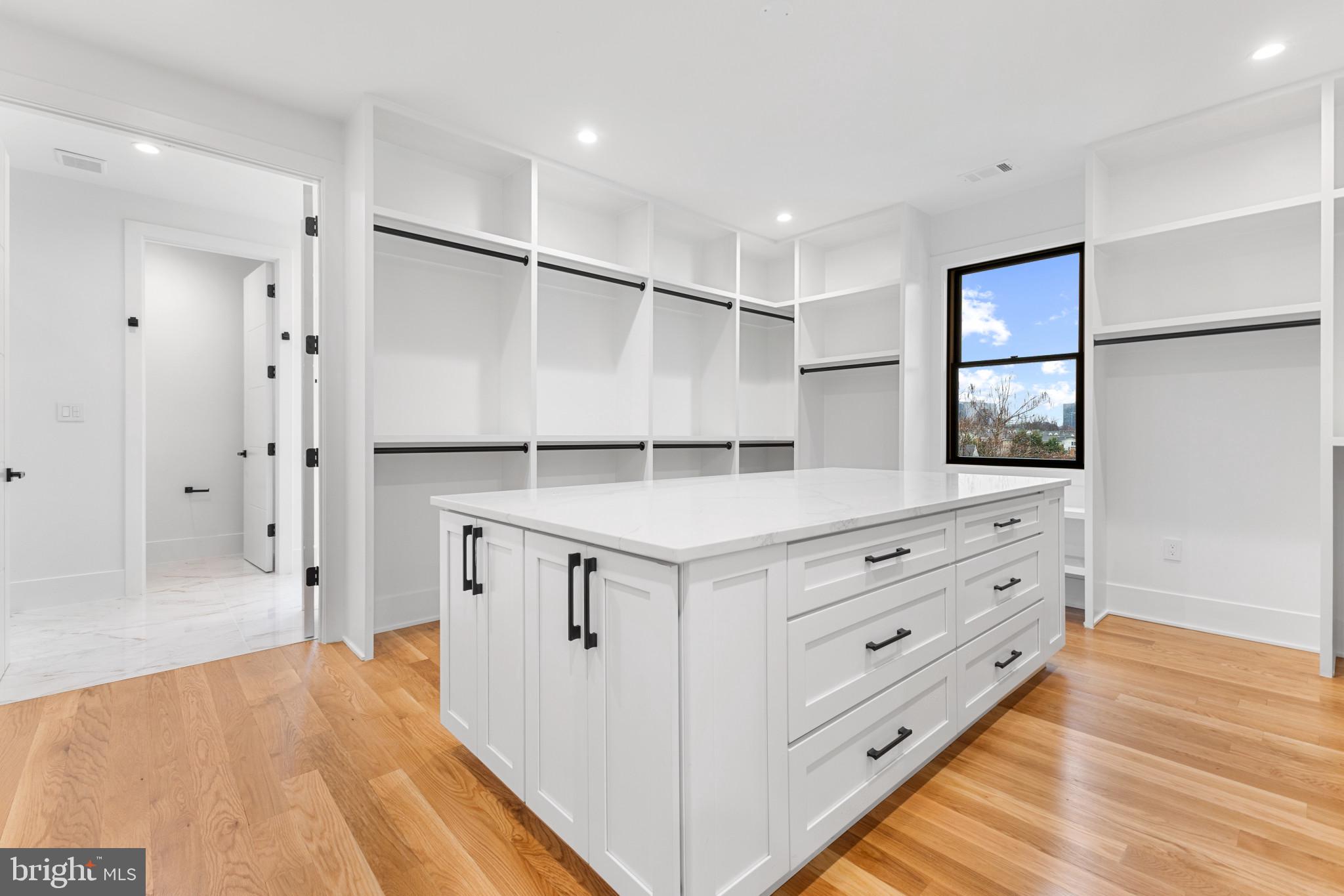 1912 Anderson Road Falls Church, VA 22043 - Photo 8 of 40 a bathroom with a double vanity sink a large mirror and shower