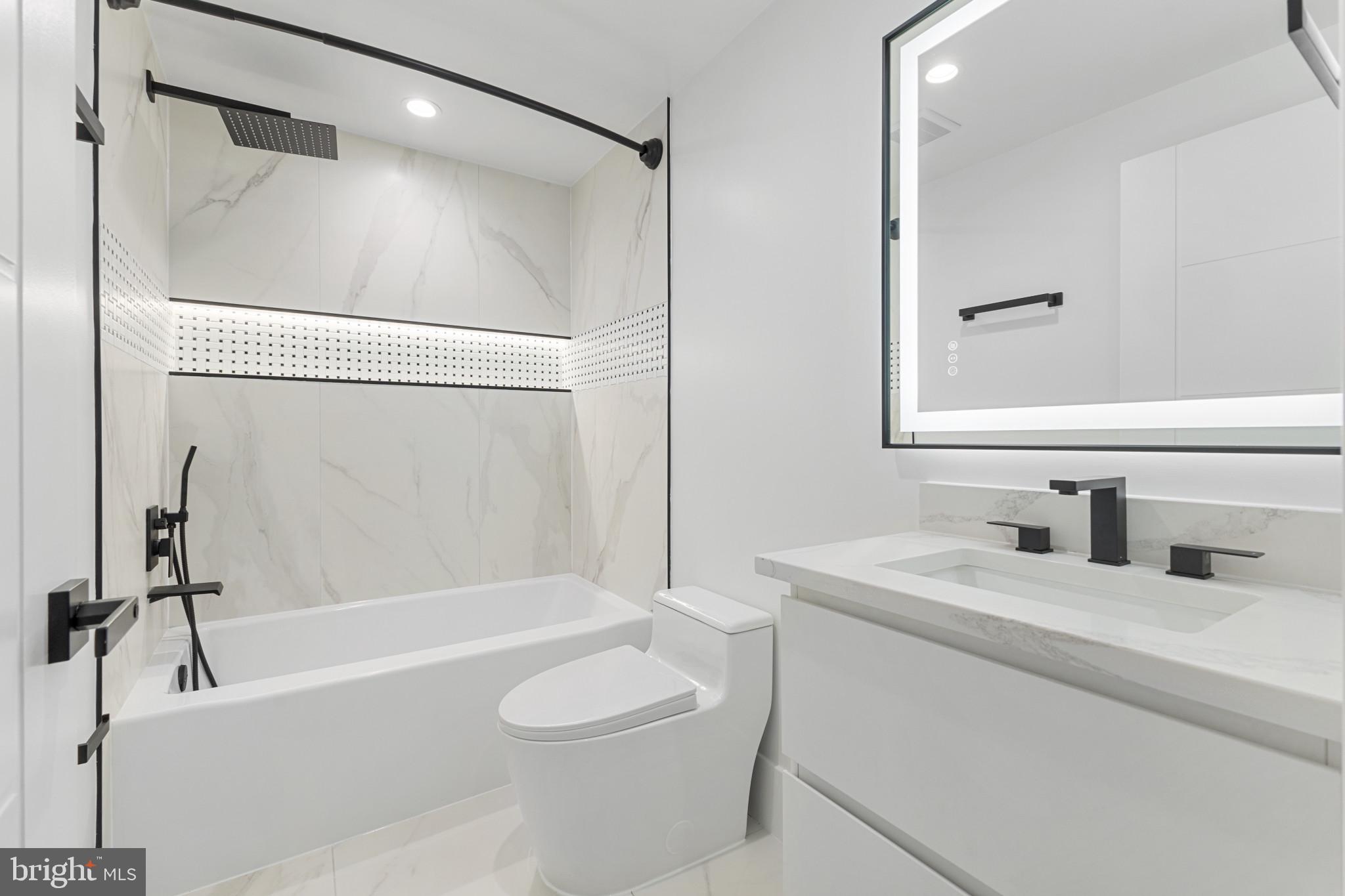 1912 Anderson Road Falls Church, VA 22043 - Photo 27 of 40 a bathroom with a granite countertop sink toilet and shower