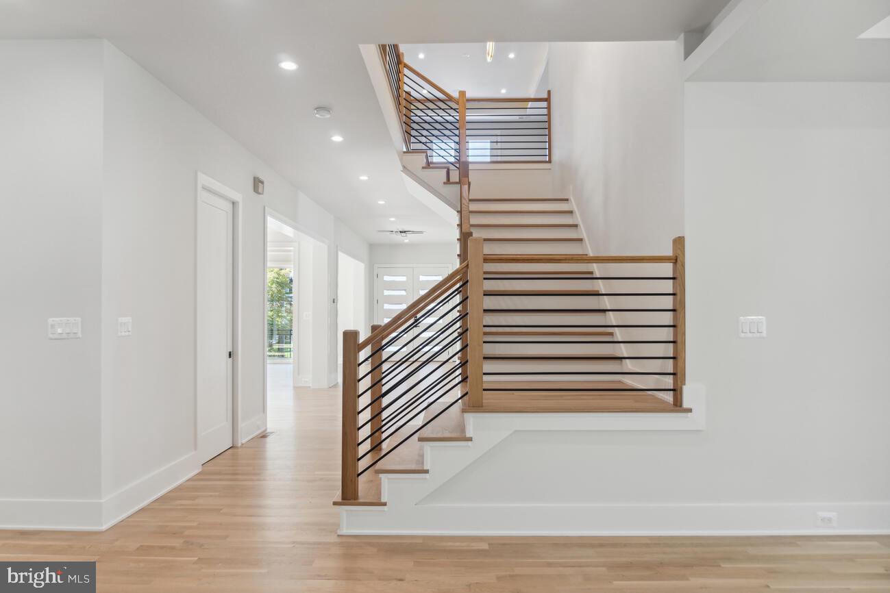 1912 Anderson Road Falls Church, VA 22043 - Photo 4 of 40 a view of a hallway with stairs and wooden floor