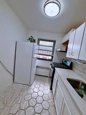 a kitchen with a stove and a refrigerator