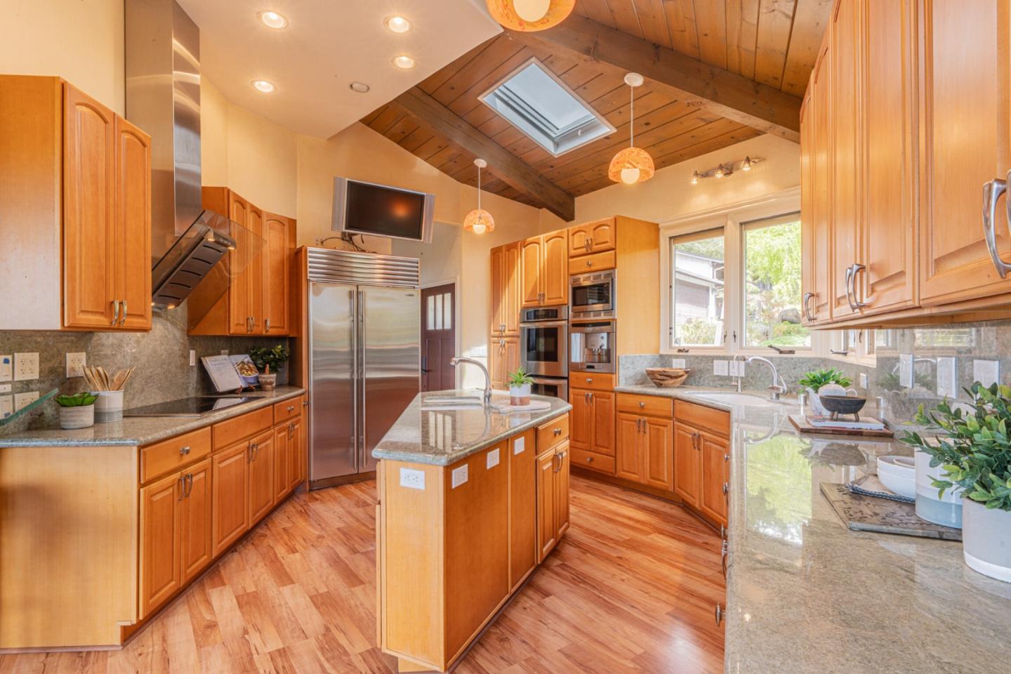 430 Quail Run Road Aptos, CA 95003 - Photo 21 of 34 a kitchen with stainless steel appliances granite countertop a sink and cabinets