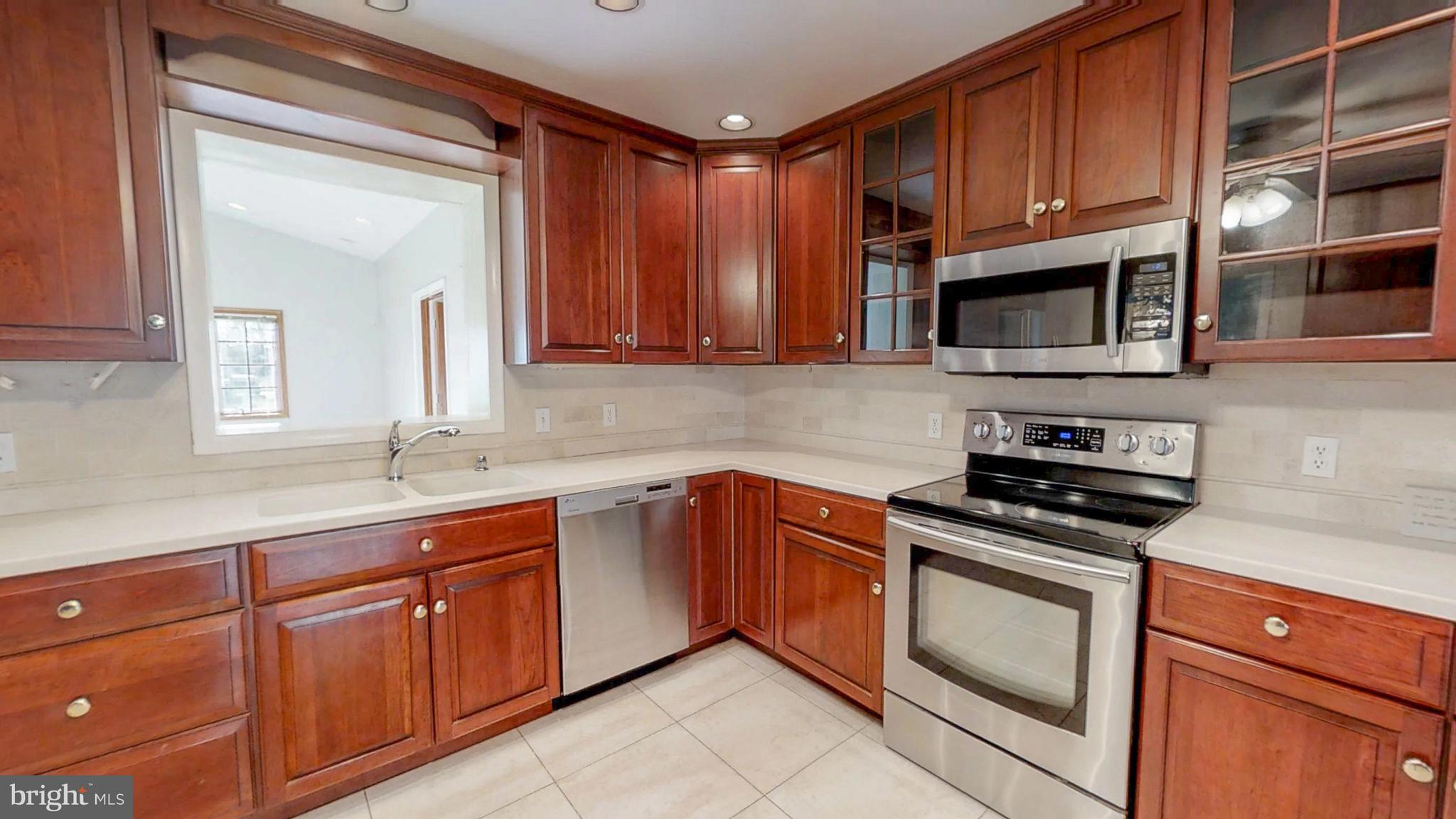 2402 Brickton Road Wilmington, DE 19803 - Photo 11 of 25 Stainless steel appliances & Corian countertops