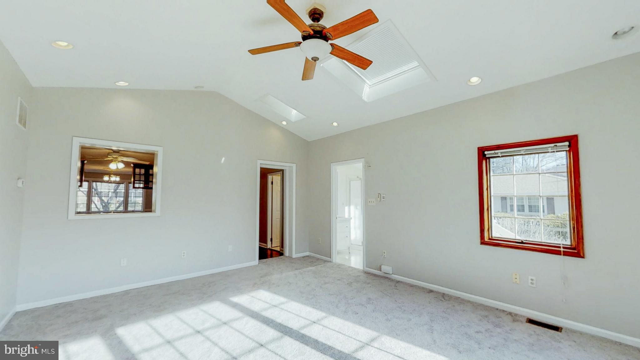 2402 Brickton Road Wilmington, DE 19803 - Photo 13 of 25 Family room has ceiling fan and new neutral carpet