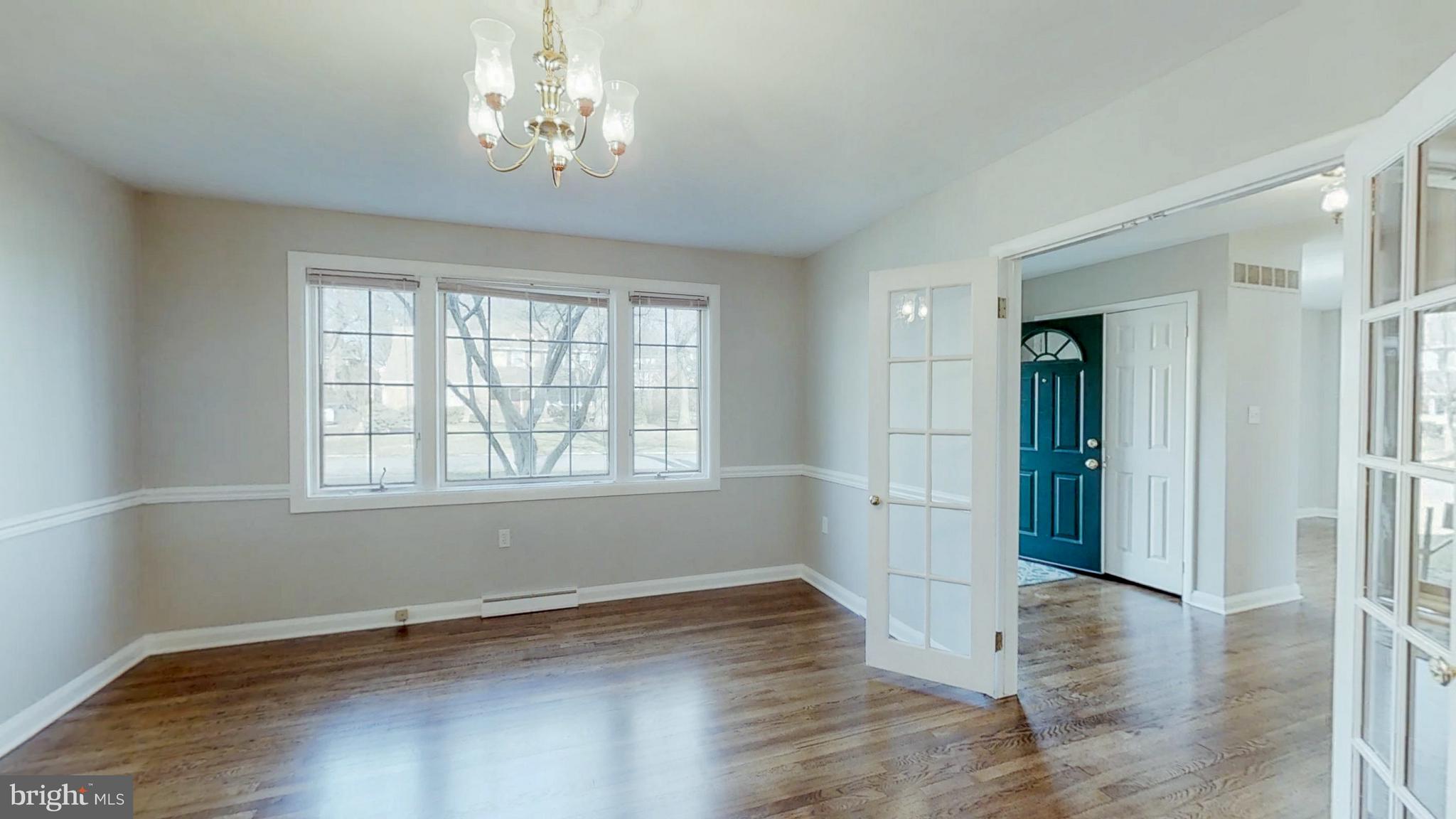 2402 Brickton Road Wilmington, DE 19803 - Photo 8 of 25 Large dining room with chair rail & French doors