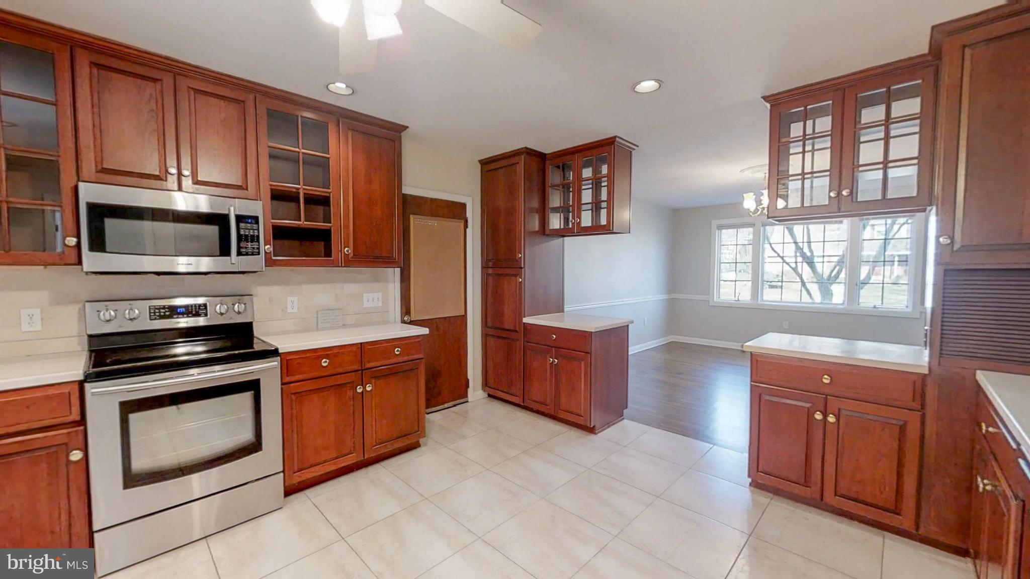 2402 Brickton Road Wilmington, DE 19803 - Photo 9 of 25 Full renovated kitchen w/ tile floor & backsplash