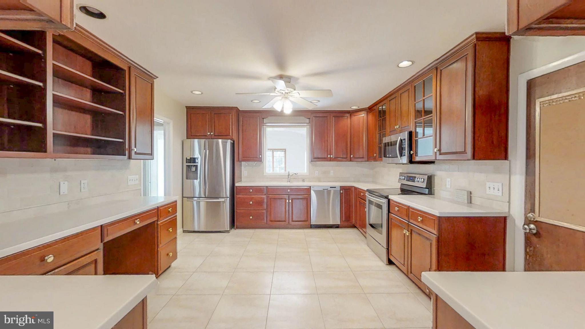 2402 Brickton Road Wilmington, DE 19803 - Photo 10 of 25 Cherry cabinets, ceiling fan & recessed lights