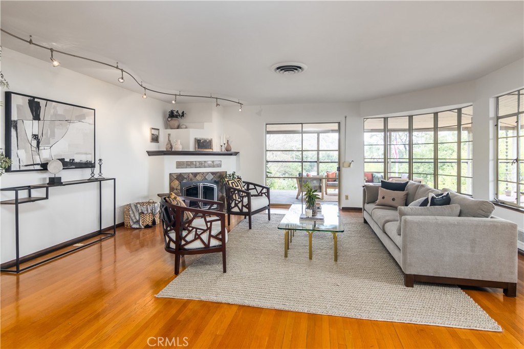 751 Ridgeside Drive Monrovia, CA 91016 - Photo 13 of 65 a living room with furniture and a wooden floor