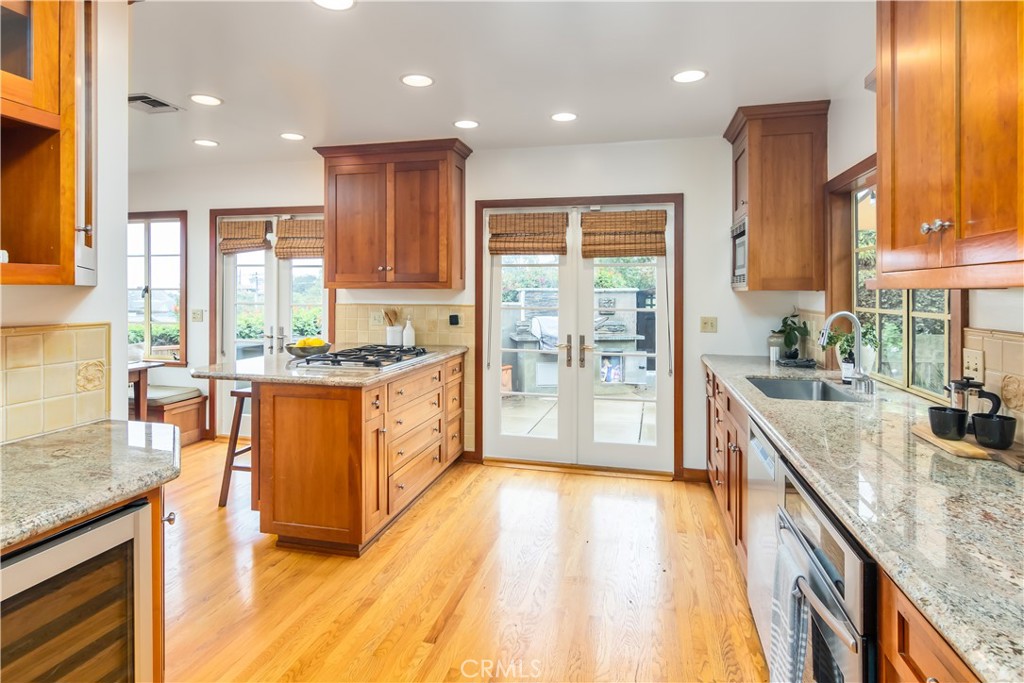 751 Ridgeside Drive Monrovia, CA 91016 - Photo 21 of 65 a large kitchen with stainless steel appliances granite countertop a large stove a sink and a refrigerator