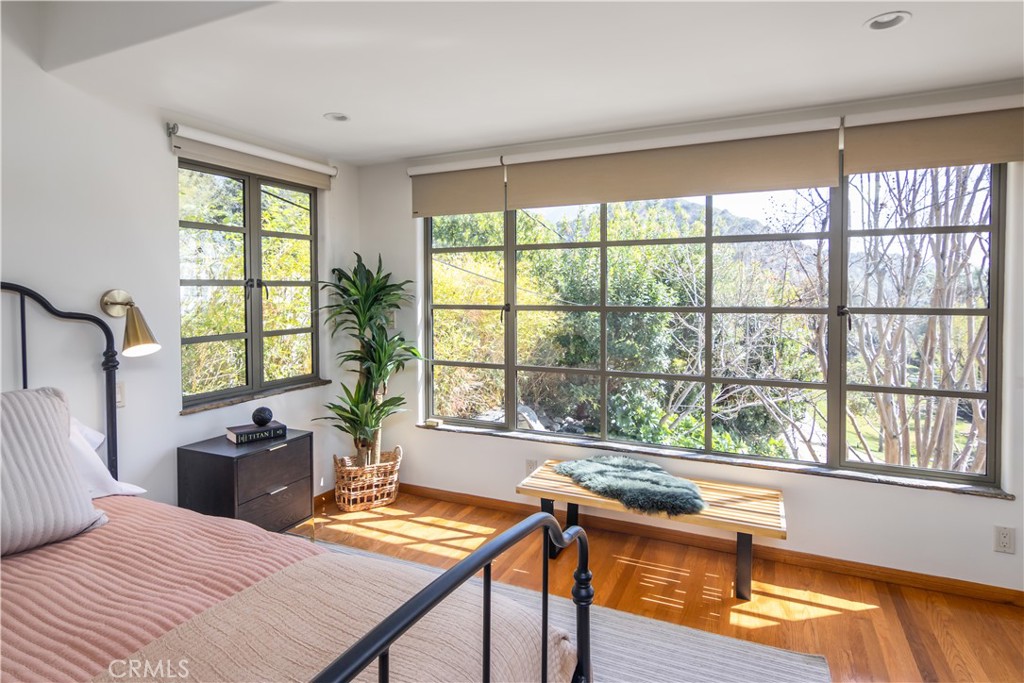 751 Ridgeside Drive Monrovia, CA 91016 - Photo 33 of 65 a bedroom with a bed and a table