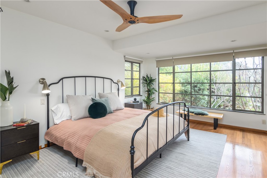 751 Ridgeside Drive Monrovia, CA 91016 - Photo 36 of 65 a bedroom with a bed next to a large window with wooden floor