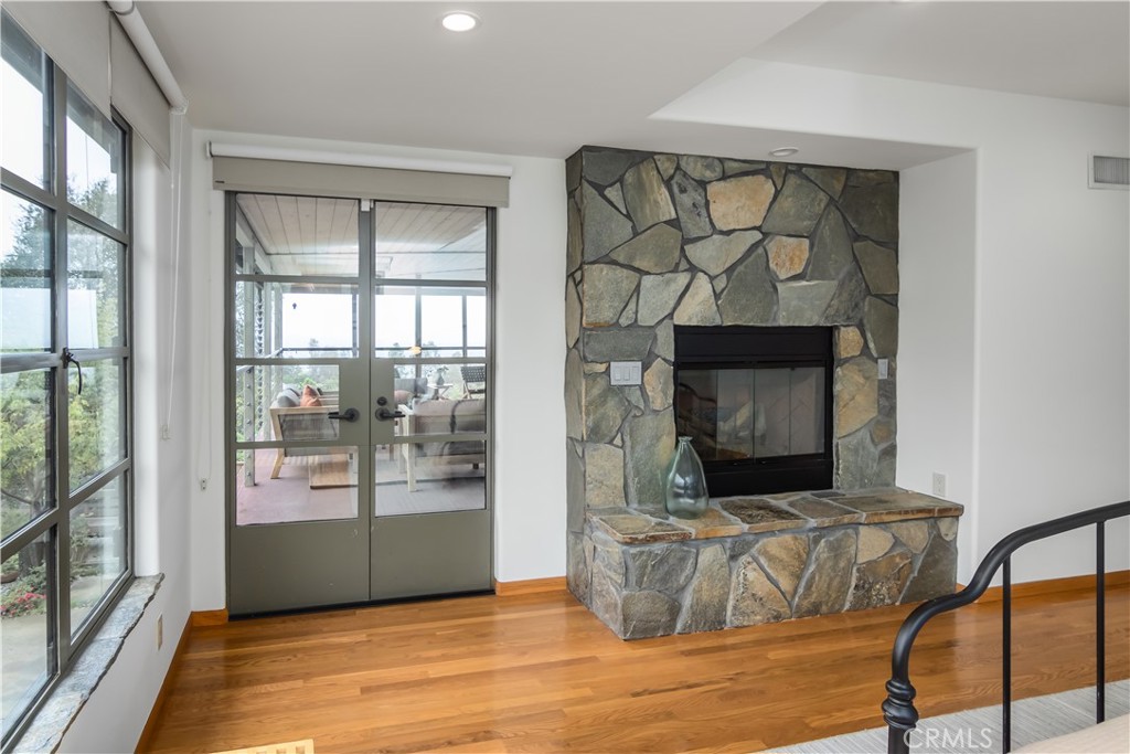 751 Ridgeside Drive Monrovia, CA 91016 - Photo 38 of 65 a living room with fireplace furniture and a flat screen tv