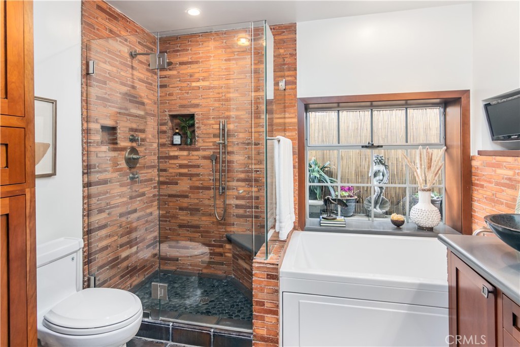 751 Ridgeside Drive Monrovia, CA 91016 - Photo 40 of 65 a bathroom with a sink toilet and shower