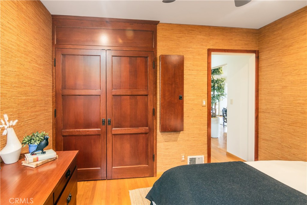 751 Ridgeside Drive Monrovia, CA 91016 - Photo 43 of 65 a bedroom with a bed and wooden floor