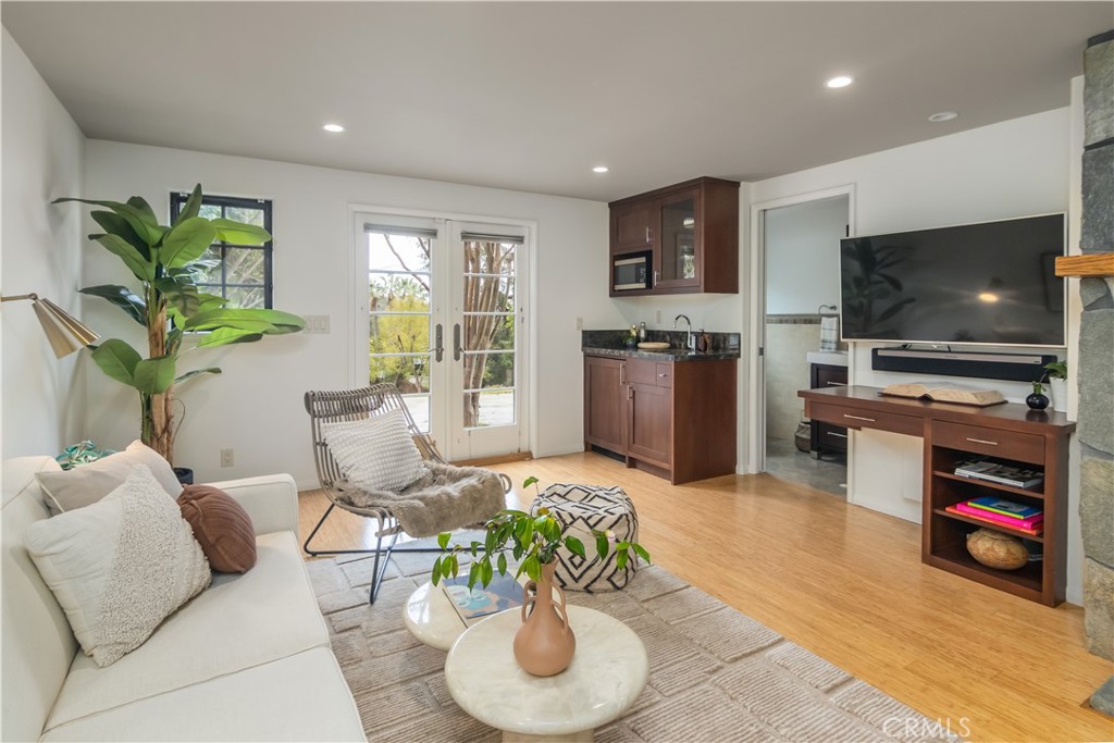 751 Ridgeside Drive Monrovia, CA 91016 - Photo 48 of 65 a living room with furniture and a flat screen tv