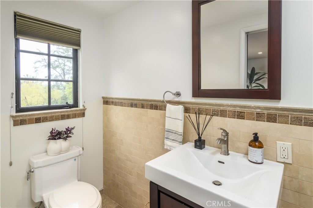 751 Ridgeside Drive Monrovia, CA 91016 - Photo 51 of 65 a bathroom with a sink and a toilet