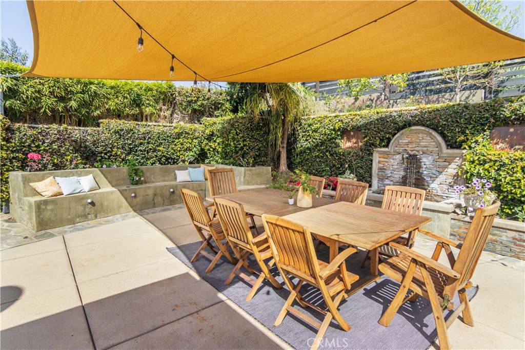 751 Ridgeside Drive Monrovia, CA 91016 - Photo 55 of 65 a view of a patio with table and chairs and potted plants