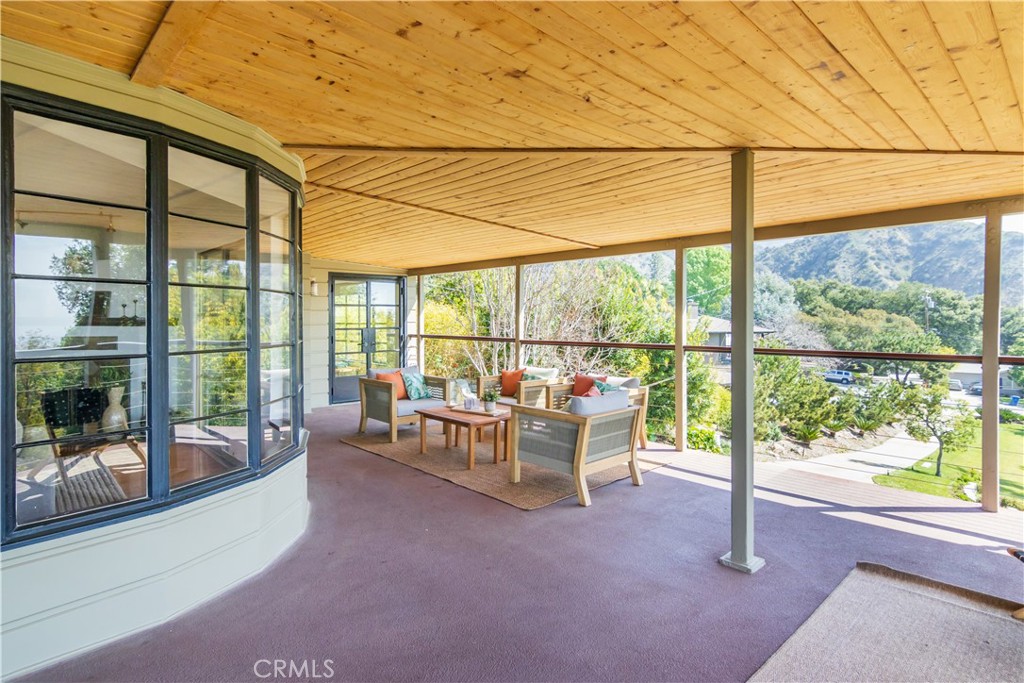 751 Ridgeside Drive Monrovia, CA 91016 - Photo 8 of 65 a living room with furniture and floor to ceiling windows