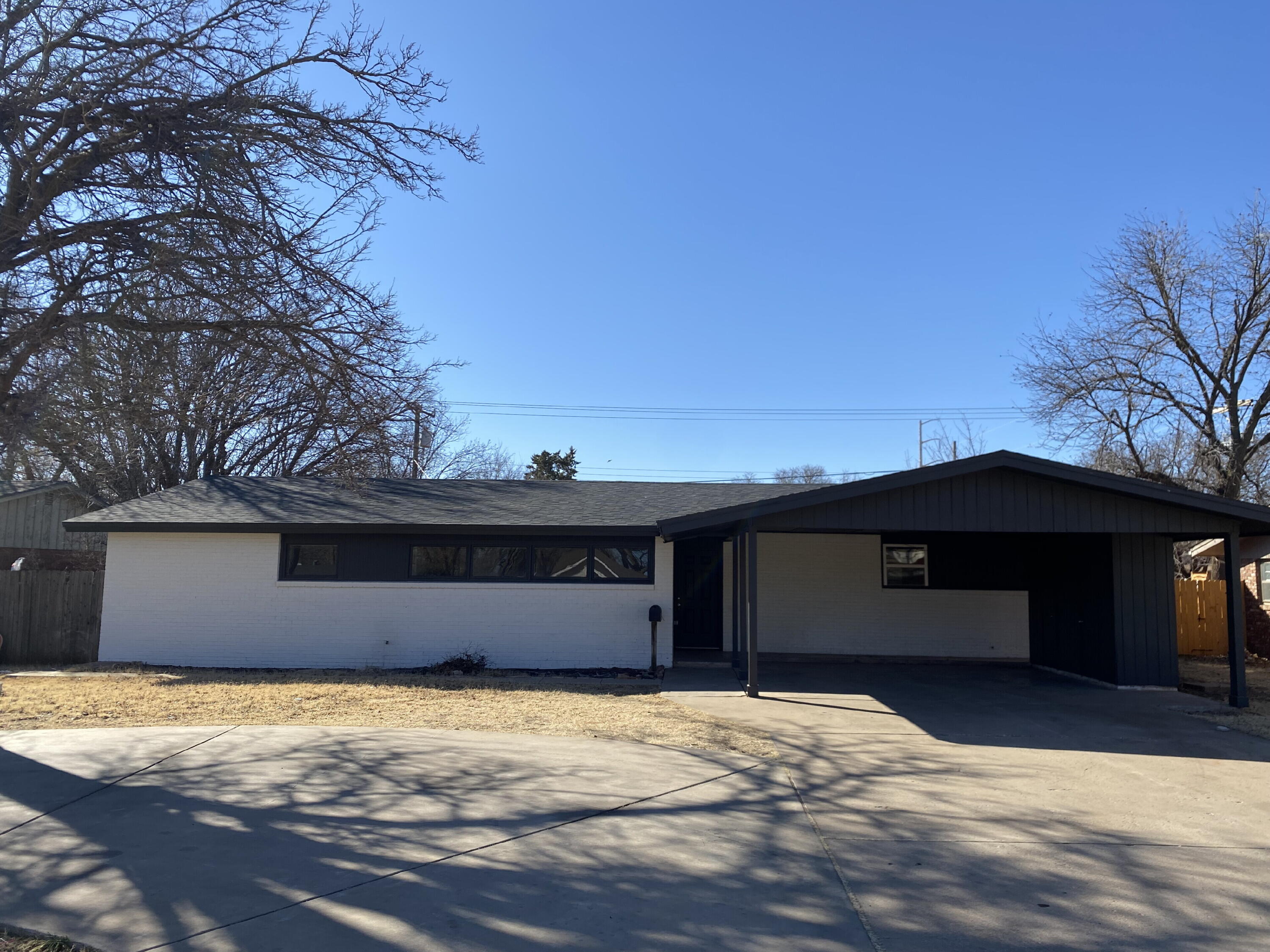 2823 56th Street Lubbock, TX 79413 - Photo 2 of 15 a house with trees in the background