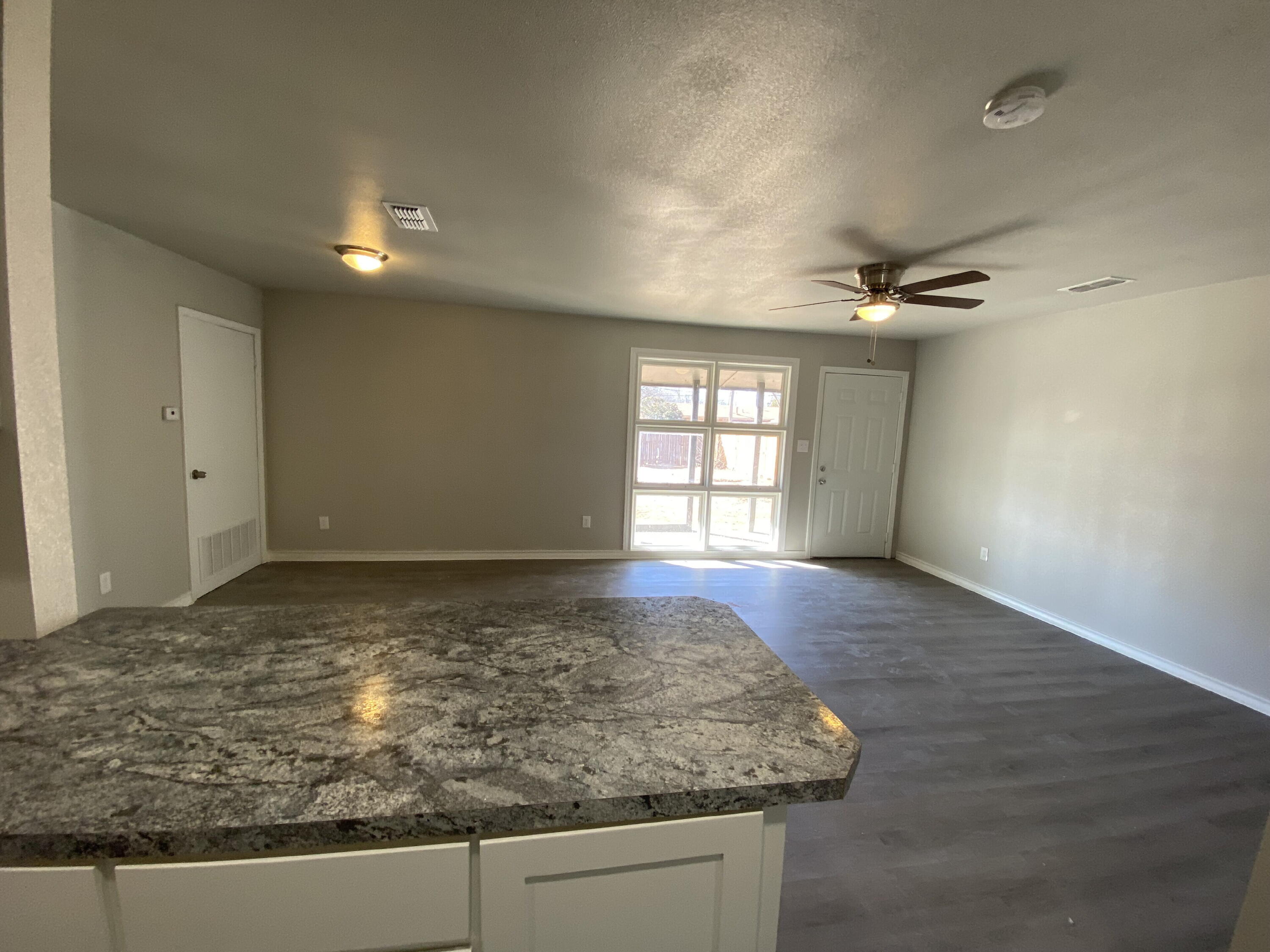 2823 56th Street Lubbock, TX 79413 - Photo 3 of 15 a view of a kitchen and a window