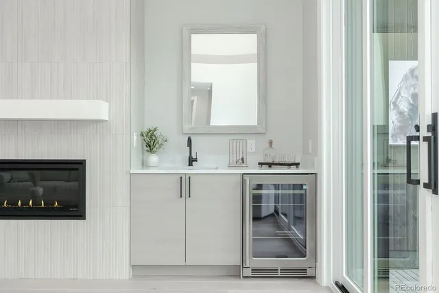 a kitchen with a stove and white cabinets