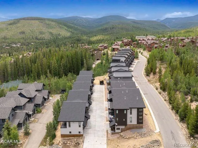 a view of a city with mountains in the background